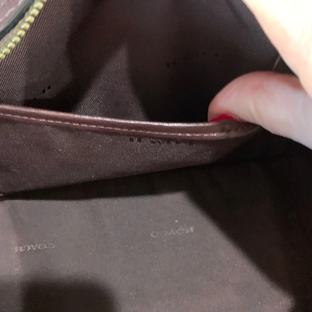 Coach Leather Handbag with shoulder straps. Plum in color